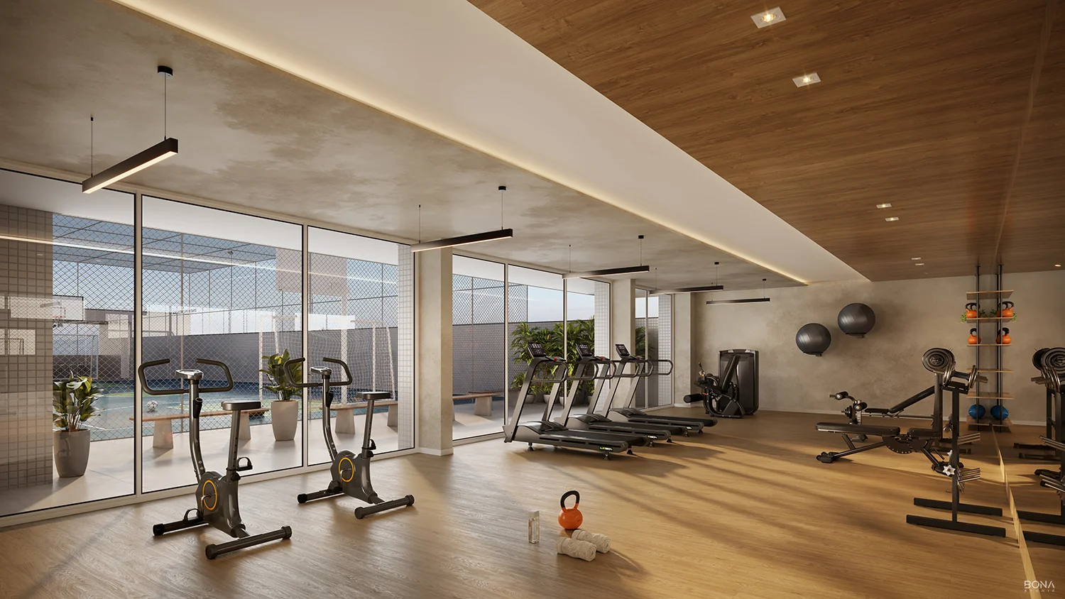 Espaço fitness do Altavista Ubirajara, academia envidraçada com vista direta para a quadra poliesportiva