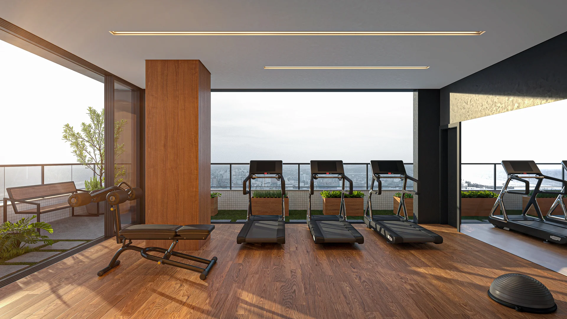 Espaço fitness do Cascais Soft Living com esteiras e vista panorâmica da cidade