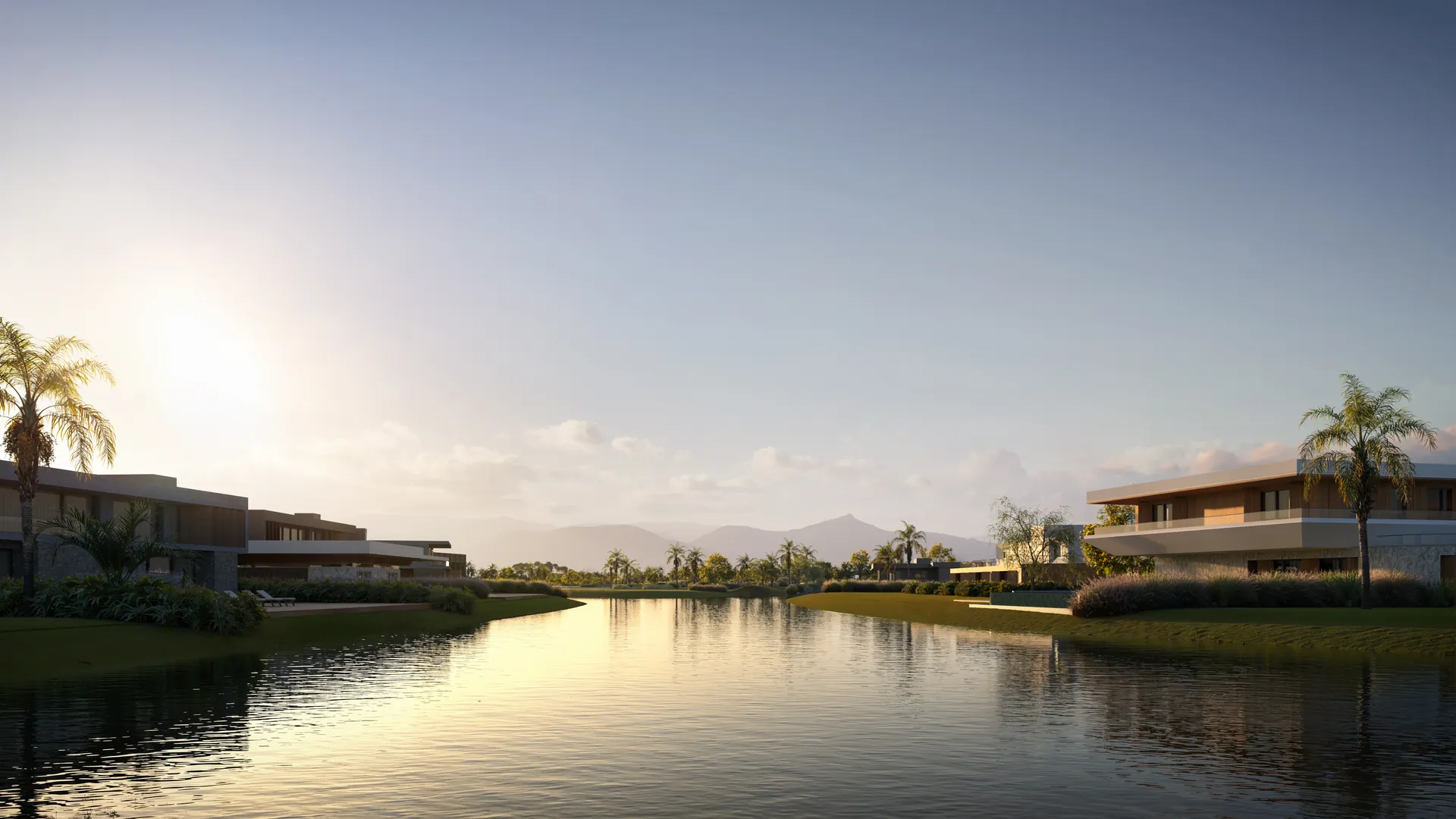 Casas refletidas na água ao entardecer, com canais internos do Enseada da Lagoa
