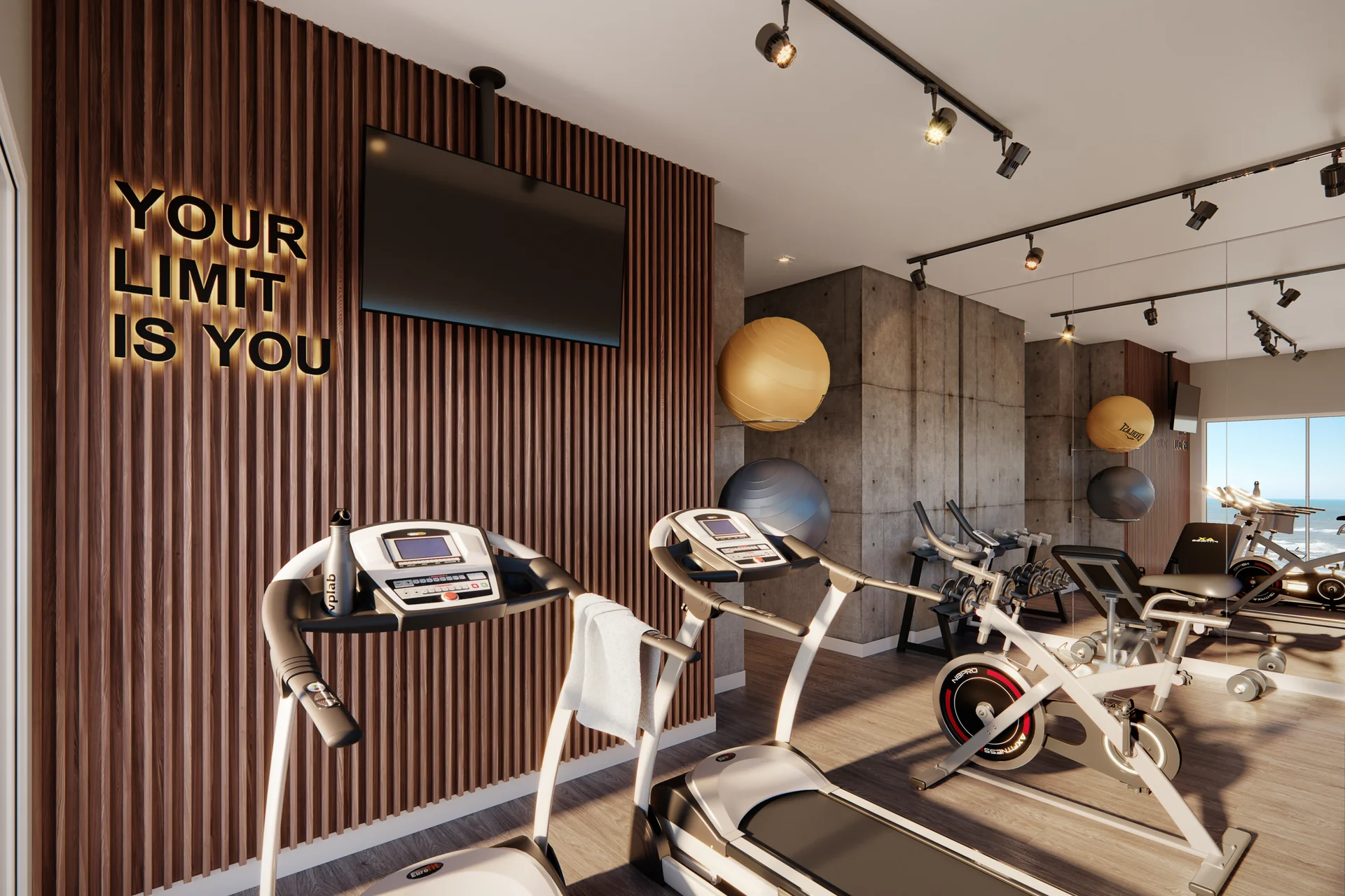 Espaço fitness do Epic Residence equipado, com vista para o mar