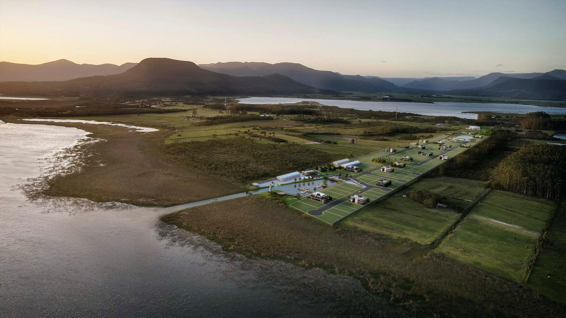Vista aérea do condomínio entre a lagoa e as montanhas ao entardecer, La Marina Reserva em Maquiné