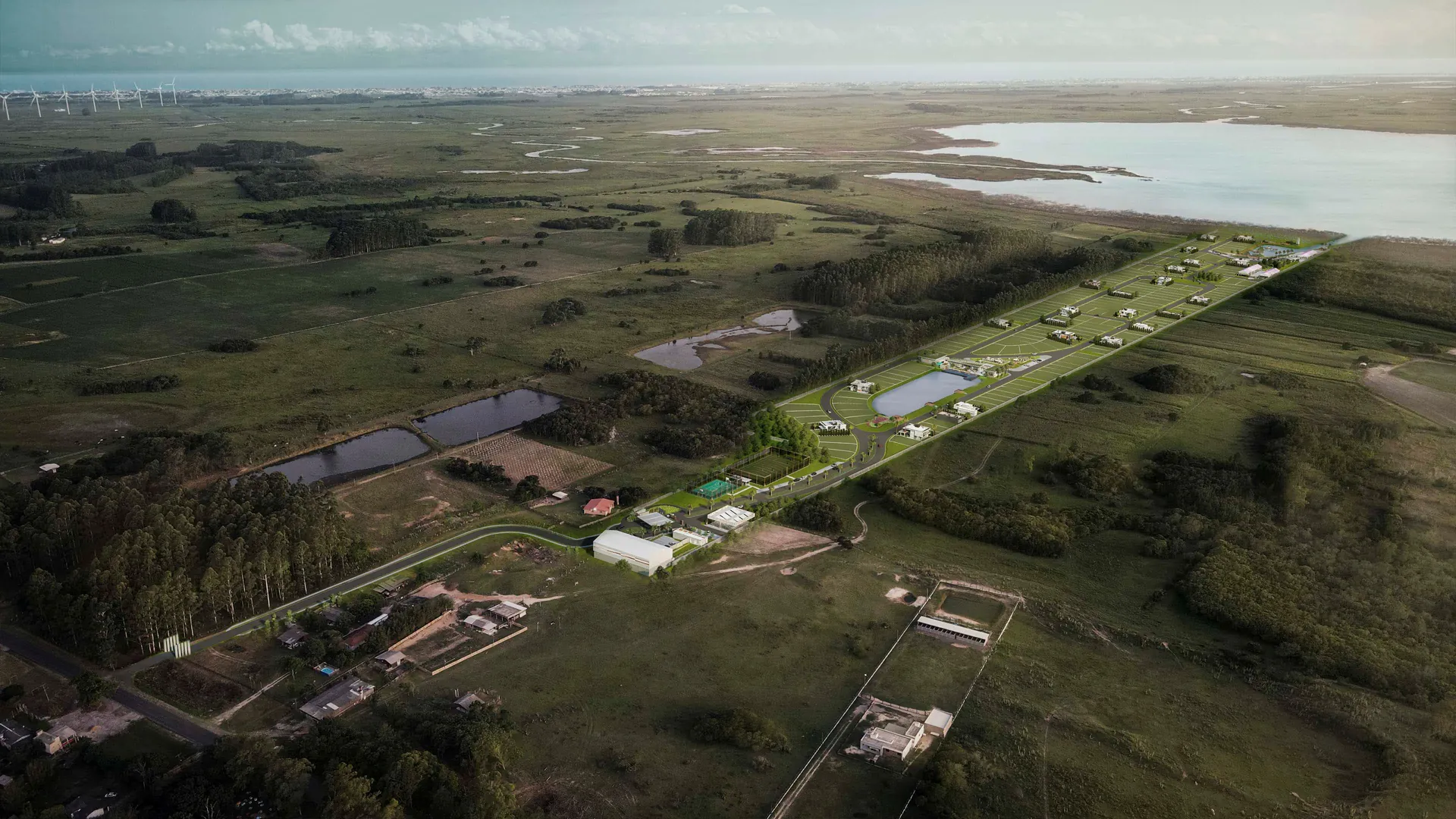 Vista aérea ampla mostrando La Marina Reserva entre campos, a Lagoa das Malvas e o sistema de lagoas de Maquiné