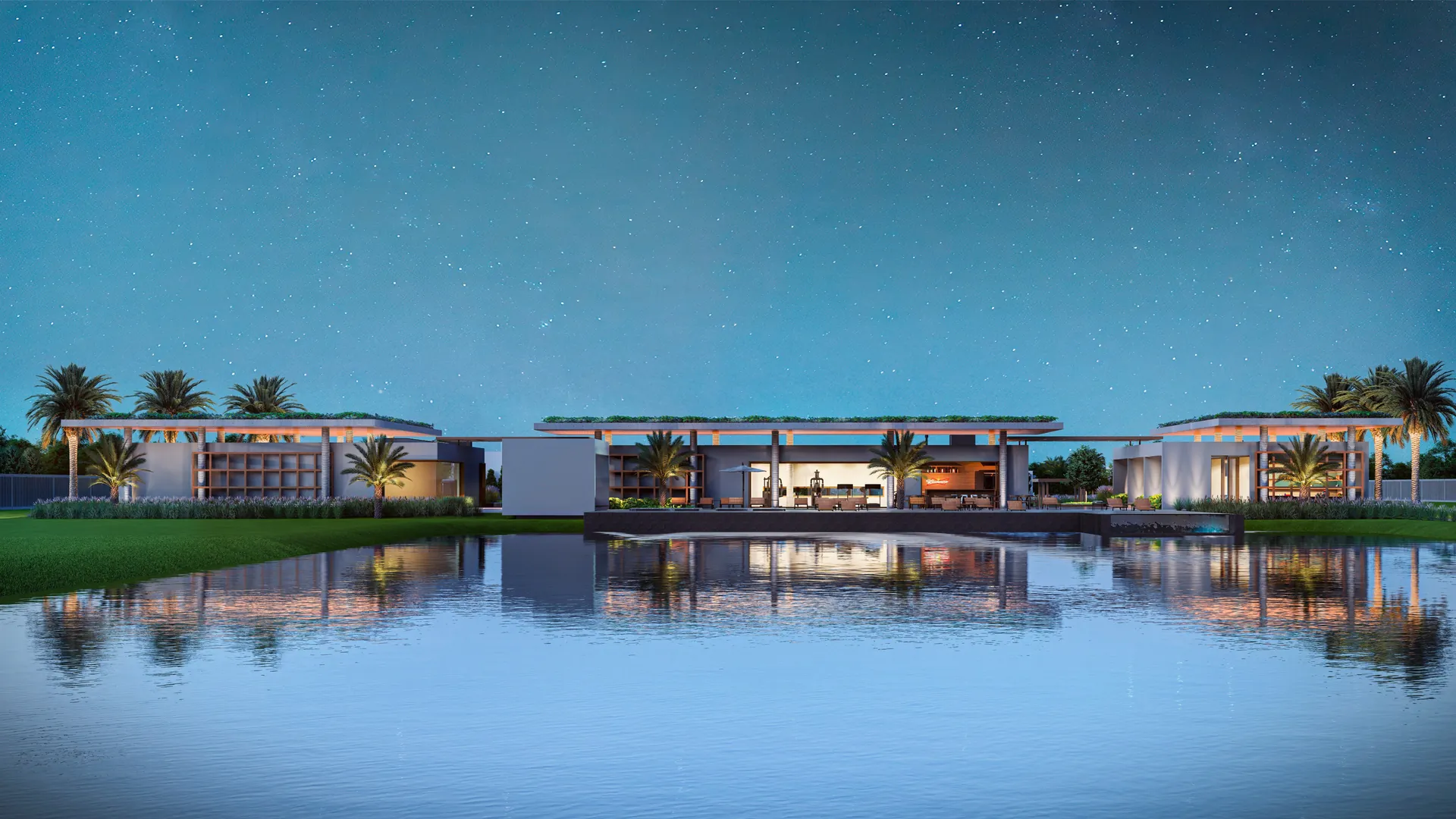 Clube de La Marina Reserva ao anoitecer, refletido na lâmina d'água da lagoa interna