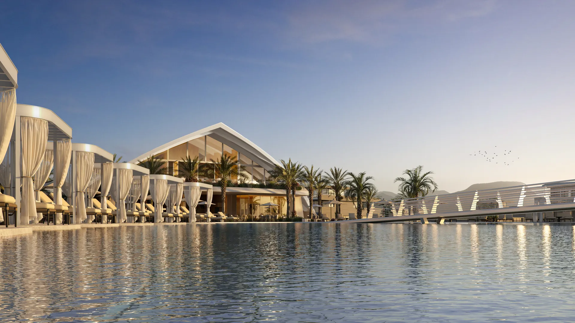 Piscina com cabanas de cortinas brancas e clube ao fundo, Mônaco Grand Marina em Maquiné