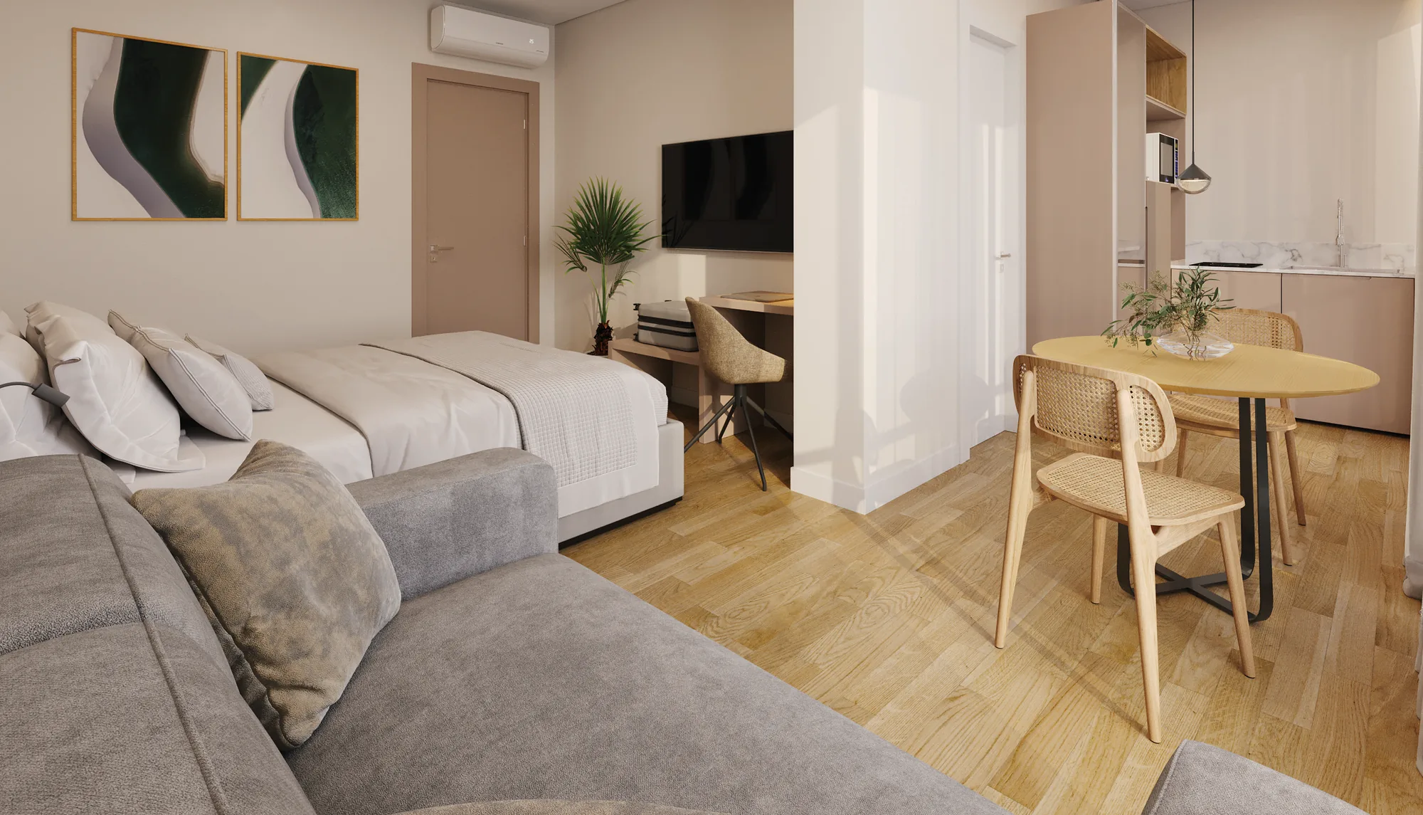 Interior de suíte do ZAYA Design Suites com living integrado em tons neutros e madeira clara