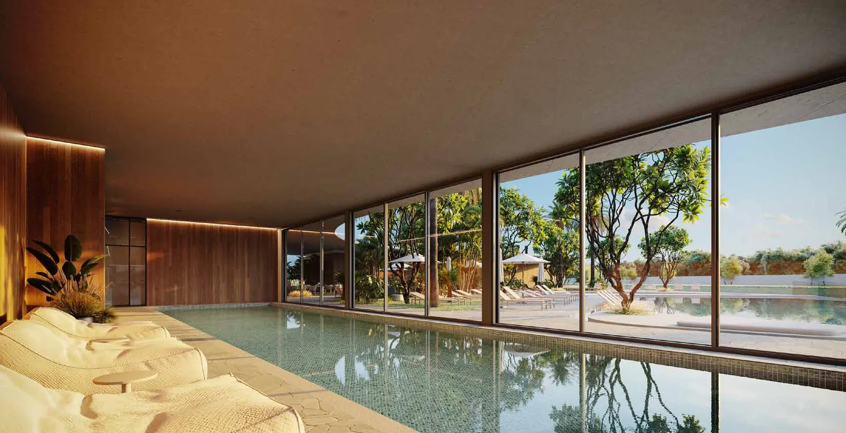 Piscina indoor do ZEN Concept Resort com fechamento em vidro voltado ao paisagismo em Xangri-Lá